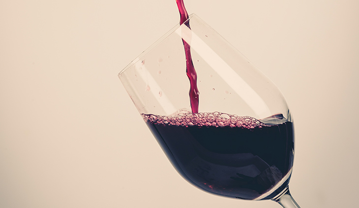 Red wine being poured into glass