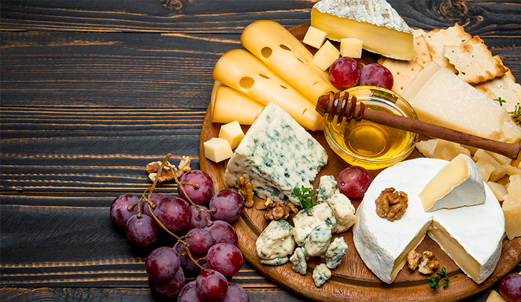 Assorted cheeses on a cheese board