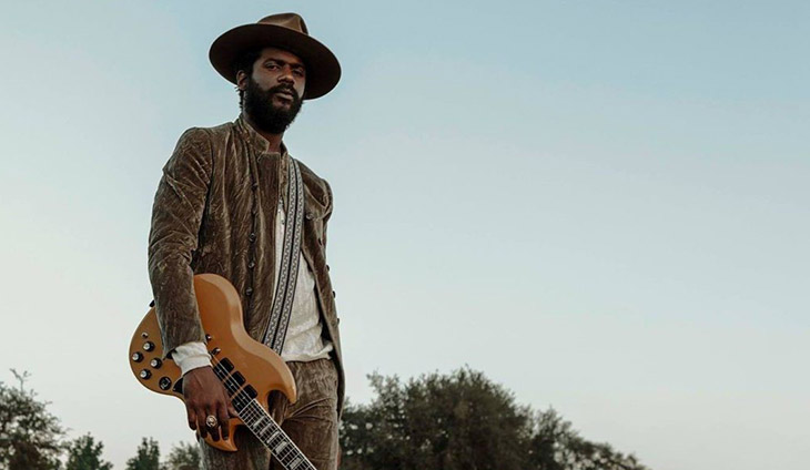 Gary Clark Jr. holding a guitar