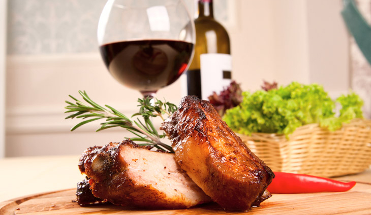 Pork dinner with a glass of wine