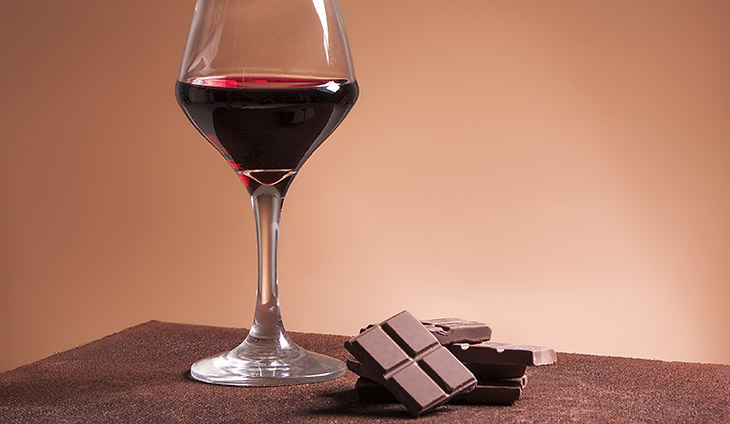 Glass of red wine with chocolate