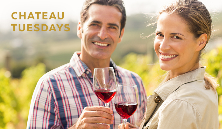 Man & woman clinking glasses and smiling