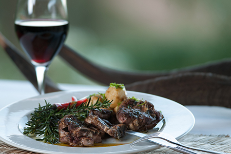 Plate of food with glass of red wine