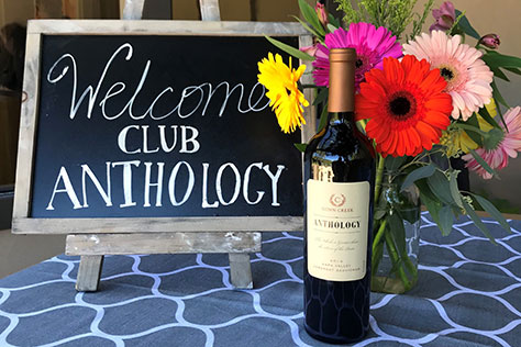 Welcome sign with a Conn Creek wine bottle